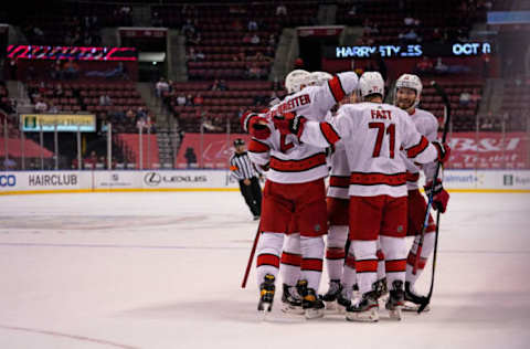 Mar 1, 2021; Sunrise, Florida, USA; Carolina Hurricanes defenseman Brett Pesce (22) celebrates his goal against the Florida Panthers with teammates on the ice during the first period at BB&T Center. Mandatory Credit: Jasen Vinlove-USA TODAY Sports