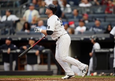 Oct 2, 2016; Bronx, NY, USA; New York Yankees catcher Brian McCann (34) hits a home run in the bottom of the fourth inning against the Baltimore Orioles at Yankee Stadium. It was the 20th home run of the season for McCann. Mandatory Credit: Danny Wild-USA TODAY Sports