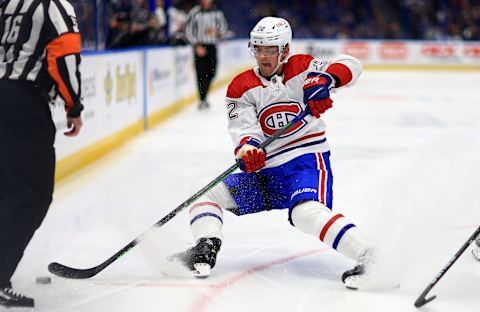 TAMPA, FLORIDA – APRIL 02: Justin Barron #52 of the Montreal Canadiens looks to pass in the first period during a game against the Tampa Bay Lightning at Amalie Arena on April 02, 2022, in Tampa, Florida. (Photo by Mike Ehrmann/Getty Images)