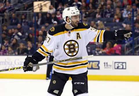 Feb 16, 2016; Columbus, OH, USA; Boston Bruins center Patrice Bergeron (37) points out direction to teammates against the Columbus Blue Jackets in the second period at Nationwide Arena. Mandatory Credit: Aaron Doster-USA TODAY Sports