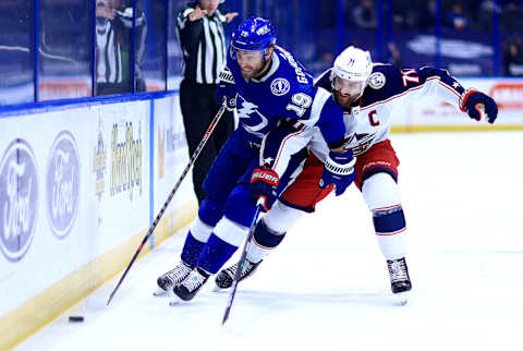 TAMPA, FLORIDA – APRIL 01: Barclay Goodrow #19 of the Tampa Bay Lightning and Nick Foligno #71 of the Columbus Blue Jackets  (Photo by Mike Ehrmann/Getty Images)