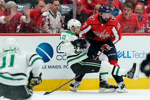 WASHINGTON, DC – OCTOBER 08: Radek Faksa #12 of the Dallas Stars and Radko Gudas #33 of the Washington Capitals collide in the first period at Capital One Arena on October 8, 2019 in Washington, DC. (Photo by Patrick McDermott/NHLI via Getty Images)