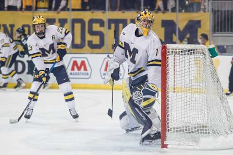 Michigan goaltender Erik Portillo (1) looks back as he defends the goal against Michigan State during the second period of the first game in a Big Ten quarterfinal at Yost Ice Arena in Ann Arbor on Friday, March 4, 2022.