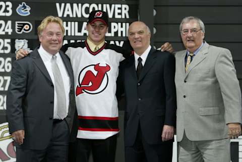 Zach Parise, Lou Lamoriello. (Photo by Elsa/Getty Images/NHLI)