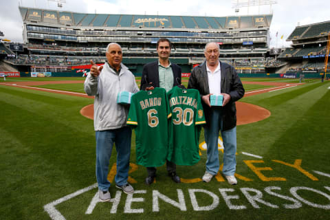 OAKLAND, CA – MAY 25: President David Kaval of the Oakland Athletics presents Sal Bando and Ken Holtzman as members of the Athletics 50th Anniversary Team during a pregame ceremony prior to the game between the Athletics and the Arizona Diamondbacks at the Oakland Alameda Coliseum on May 25, 2018 in Oakland, California. The Diamondbacks defeated the Athletics 7-1. (Photo by Michael Zagaris/Oakland Athletics/Getty Images)