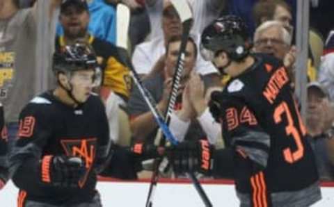 Sep 14, 2016; Pittsburgh, PA, USA; Team North America forward Johnny Gaudreau (13) and forward Auston Matthews (34) celebrate a goal by Matthews against the Team Czech Republic during the third period in a World Cup of Hockey pre-tournament game at CONSOL Energy Center. Team Czech Republic won 3-2. Mandatory Credit: Charles LeClaire-USA TODAY Sports