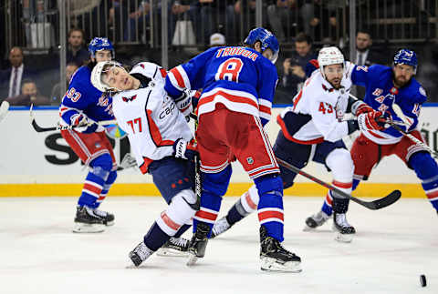 Apr 29, 2022; New York, New York, USA; Washington Capitals right wing T.J. Oshie (77) reacts after getting elbowed by New York Rangers defenseman Jacob Trouba (8) during the third period at Madison Square Garden. Mandatory Credit: Danny Wild-USA TODAY Sports