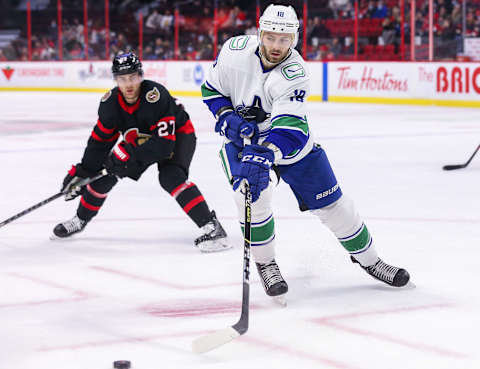 OTTAWA, ONTARIO – DECEMBER 01: Jason Dickinson #18 of the Vancouver Canucks skates against the Ottawa Senators at Canadian Tire Centre on December 01, 2021 in Ottawa, Ontario. (Photo by Chris Tanouye/Getty Images)