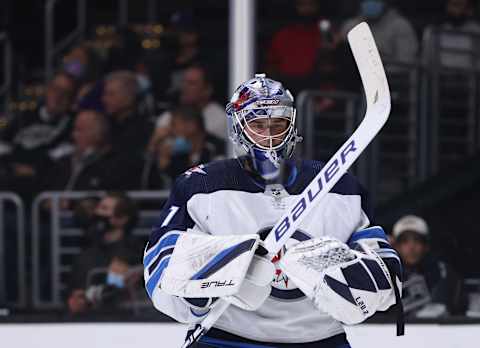 LOS ANGELES, CALIFORNIA – OCTOBER 28: Eric Comrie #1 of the Winnipeg Jets reacts after a goal during a 3-2 Jets win over the Los Angeles Kings at Staples Center on October 28, 2021 in Los Angeles, California. (Photo by Harry How/Getty Images)