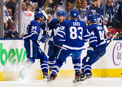 TORONTO, ON - OCTOBER 2: Auston Matthews #34 of the Toronto Maple Leafs celebrates his goal with teammates Andreas Johnsson #18, Cody Ceci #83, and Morgan Rielly #44 against the Ottawa Senators during the second period at the Scotiabank Arena on October 2, 2019 in Toronto, Ontario, Canada. (Photo by Mark Blinch/NHLI via Getty Images)