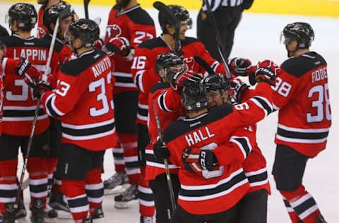 Nov 8, 2016; Newark, NJ, USA; New Jersey Devils left wing Taylor Hall (9) celebrates his game winning goal during the shootout at Prudential Center. The Devils defeated the Hurricanes 3-2 in a shootout. Mandatory Credit: Ed Mulholland-USA TODAY Sports