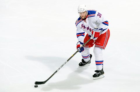 WASHINGTON, DC – APRIL 23: Michael Sauer #38 of the New York Rangers handles the puck during Game Five of the Eastern Conference Quarterfinals of the 2011 NHL Stanley Cup Playoffs against the Washington Capitals at the Verizon Center on April 23, 2011 in Washington, DC. (Photo by G Fiume/Getty Images)