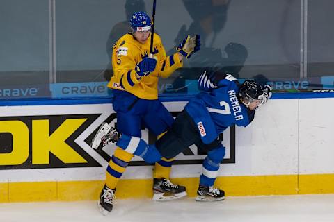 EDMONTON, AB – JANUARY 02: Elmer Soderblom #25 of Sweden skates against Topi Niemela #7 o  (Photo by Codie McLachlan/Getty Images)