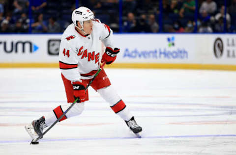 TAMPA, FLORIDA – OCTOBER 01: Joey Keane #44 of the Carolina Hurricanes shoots during a preseason game against the Tampa Bay Lightning at Amalie Arena on October 01, 2021, in Tampa, Florida. (Photo by Mike Ehrmann/Getty Images)