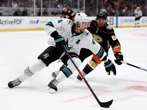 ANAHEIM, CALIFORNIA – SEPTEMBER 24: Brenden Dillon #4 of the San Jose Sharks turns as he is chased by Kiefer Sherwood #64 of the Anaheim Ducks during the first period in a preseason game at Honda Center on September 24, 2019 in Anaheim, California. (Photo by Harry How/Getty Images)