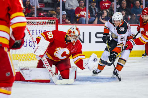 Apr 2, 2023; Calgary, Alberta, CAN; Calgary Flames goaltender Dan Vladar (80) makes a save against Anaheim Ducks center Isac Lundestrom (21) during the third period at Scotiabank Saddledome. Mandatory Credit: Sergei Belski-USA TODAY Sports