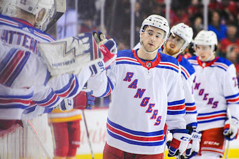 CALGARY, AB – MARCH 15: Neal Pionk #44 of the New York Rangers celebrates with the bench after scoring against the Calgary Flames during an NHL game at Scotiabank Saddledome on March 15, 2019 in Calgary, Alberta, Canada. (Photo by Derek Leung/Getty Images)