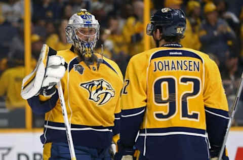 May 5, 2016; Nashville, TN, USA; Nashville Predators goalie Pekka Rinne (35) talks with teammate center Ryan Johansen (92) during a stop in play against the San Jose Sharks in game four of the second round of the 2016 Stanley Cup Playoffs at Bridgestone Arena. The Predators won 4-3. Mandatory Credit: Aaron Doster-USA TODAY Sports