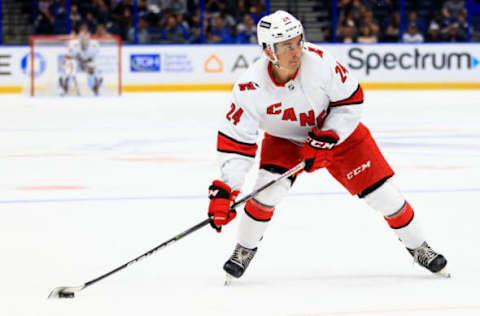 TAMPA, FLORIDA – OCTOBER 01: Seth Jarvis #24 of the Carolina Hurricanes shoots during a preseason game against the Tampa Bay Lightning at Amalie Arena on October 01, 2021, in Tampa, Florida. (Photo by Mike Ehrmann/Getty Images)