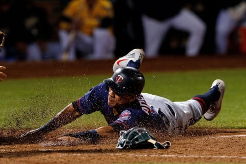 OAKLAND, CA – SEPTEMBER 22: Ehire Addrianza #16 of the Minnesota Twins slides into home plate to score a run against the Oakland Athletics during the seventh inning at the Oakland Coliseum on September 22, 2018 in Oakland, California. The Oakland Athletics defeated the Minnesota Twins 3-2. (Photo by Jason O. Watson/Getty Images)