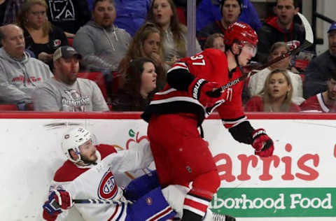 RALEIGH, NC – MARCH 24: Andrei Svechnikov #37 of the Carolina Hurricanes checks Victor Mete #53 of the Montreal Canadiens into the boards during an NHL game on March 24, 2019 at PNC Arena in Raleigh, North Carolina. (Photo by Gregg Forwerck/NHLI via Getty Images)