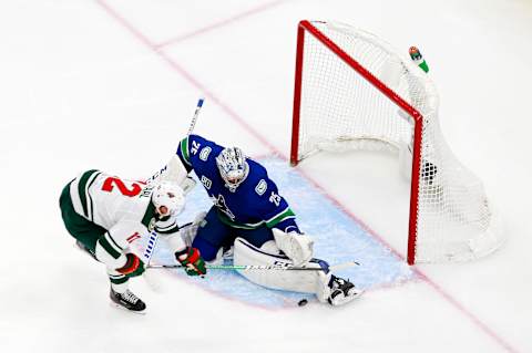 Eric Staal takes a shot on Jacob Markstrom of the Vancouver Canucks. (Photo by Jeff Vinnick/Getty Images)