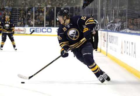 Dec 31, 2015; Buffalo, NY, USA; Buffalo Sabres center Jack Eichel (15) carries the puck during the second period against the New York Islanders at First Niagara Center. Mandatory Credit: Timothy T. Ludwig-USA TODAY Sports