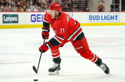 RALEIGH, NC – SEPTEMBER 29: Carolina Hurricanes center Lucas Wallmark (71) skates the puck up ice during an NHL Preseason game between the Washington Capitals and the Carolina Hurricanes on September 29, 2019 at the PNC Arena in Raleigh, NC. (Photo by Greg Thompson/Icon Sportswire via Getty Images)