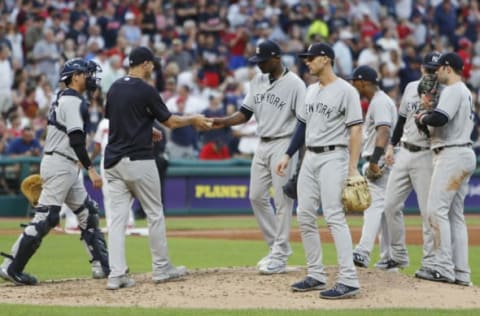 CLEVELAND, OH – JULY 13: New York Yankees Manager Aaron Boone #17 removes starting pitcher Domingo German #65 from the game during the fifth inning against the Cleveland Indians at Progressive Field on July 13, 2018 in Cleveland, Ohio. (Photo by David Maxwell/Getty Images)