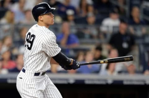 Apr 28, 2017; Bronx, NY, USA; New York Yankees right fielder Aaron Judge (99) follows through on a two run home run against the Baltimore Orioles during the sixth inning at Yankee Stadium. Mandatory Credit: Brad Penner-USA TODAY Sports