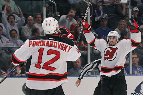 Alexei Ponikarovsky and Adam Henrique of the New Jersey Devils. (Photo by Bruce Bennett/Getty Images)