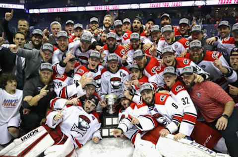 ROSEMONT, ILLINOIS – JUNE 08: Members of the Charlotte Checkers pose with the Calder Cup following during game Five of the Calder Cup Finals against the Chicago Wolves at Allstate Arena on June 08, 2019 in Rosemont, Illinois. The Checkers defeated the Wolves 5-3 to win the Calder Cup. (Photo by Jonathan Daniel/Getty Images)