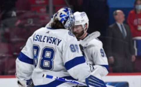 Jul 2, 2021; Montreal, Quebec, CAN; Tampa Bay Lightning goaltender Andrei Vasilevskiy (88) and center Steven Stamkos (91) celebrate after the Lightning defeated the Montreal Canadiens in game three of the 2021 Stanley Cup Final at the Bell Centre. Mandatory Credit: Eric Bolte-USA TODAY Sports