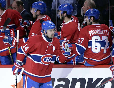 Mar 22, 2016; Montreal, Quebec, CAN; (Editors note: Caption correction) Montreal Canadiens forward Tomas Plekanec (14) celebrates with teammate Max Pacioretty (67) after a goal by Torrey Mitchell (not pictured) against the Anaheim Ducks during the first period at the Bell Centre. Mandatory Credit: Eric Bolte-USA TODAY Sports