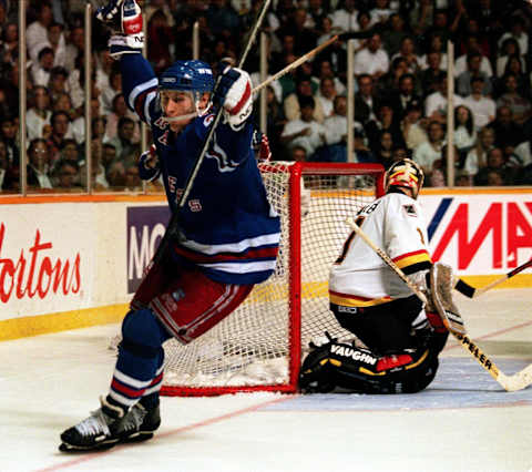 RANGERS FORWARD ALEXEI KOVALEV CELEBRATES AFTER SCORING THE WINNING GOAL TONIGHT AGAINST CANUCKS GOALTENDER KIRK MCLEAN DURING THE THIRD PERIOD OF GAME FOUR OF THE STANLEY CUP FINALS