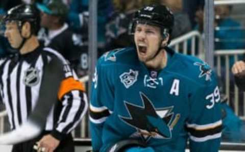 Apr 29, 2016; San Jose, CA, USA; San Jose Sharks center Logan Couture (39) celebrates after scoring a goal against the Nashville Predators in the third period in game one of the second round of the 2016 Stanley Cup Playoffs at SAP Center at San Jose. The Sharks won 5-2. Mandatory Credit: John Hefti-USA TODAY Sports