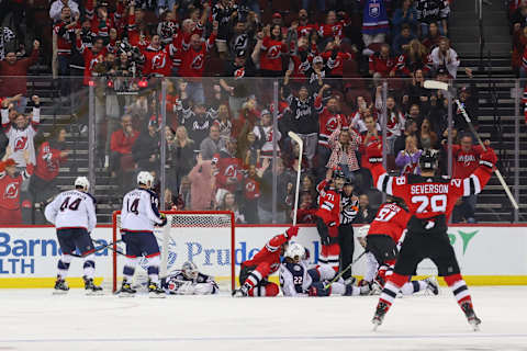 Oct 30, 2022; Newark, New Jersey, USA; New Jersey Devils defenseman Jonas Siegenthaler (71) scores a goal on Columbus Blue Jackets goaltender Elvis Merzlikins (90) during the third period at Prudential Center. Mandatory Credit: Ed Mulholland-USA TODAY Sports