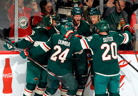 ST. PAUL, MN – OCTOBER 11: After scoring a 2nd period goal Eric Staal #12 of the Minnesota Wild is congratulated by Jason Zucker #16 of the Minnesota Wild, Matt Dumba #24 of the Minnesota Wild, Charlie Coyle #3 of the Minnesota Wild, and Ryan Suter #20 of the Minnesota Wild during a game between the Minnesota Wild and Chicago Black Hawks at Xcel Energy Center on October 11, 2018 in St. Paul, Minnesota.(Photo by Bruce Kluckhohn/NHLI via Getty Images)