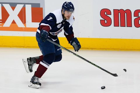 Apr 3, 2016; Denver, CO, USA; Colorado Avalanche center John Mitchell (7) controls the puck in the first period against the St. Louis Blues at the Pepsi Center. The Blues defeated the Avalanche 5-1. Mandatory Credit: Isaiah J. Downing-USA TODAY Sports