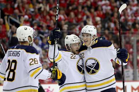 WASHINGTON, DC – DECEMBER 21: Johan Larsson #22 of the Buffalo Sabres celebrates his third period goal with Tage Thompson #72 against the Washington Capitals at Capital One Arena on December 21, 2018 in Washington, DC. (Photo by Rob Carr/Getty Images)