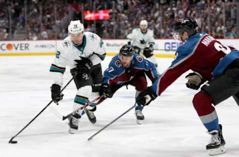 DENVER, COLORADO – MAY 02: Kevin Labanc #62 of the San Jose Sharks looks for an opening on goal against Tyson Jost #17 and Cale makar #8 of the Colorado Avalanche in the third period during Game Four of the Western Conference Second Round during the 2019 NHL Stanley Cup Playoffs at the Pepsi Center on May 2, 2019 in Denver, Colorado. (Photo by Matthew Stockman/Getty Images)