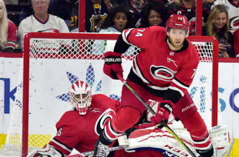 RALEIGH, NC – OCTOBER 09: Curtis McElhinney #35 and Jaccob Slavin #74 of the Carolina Hurricanes defend the goal against the Vancouver Canucks during their game at PNC Arena on October 9, 2018 in Raleigh, North Carolina. (Photo by Grant Halverson/Getty Images)