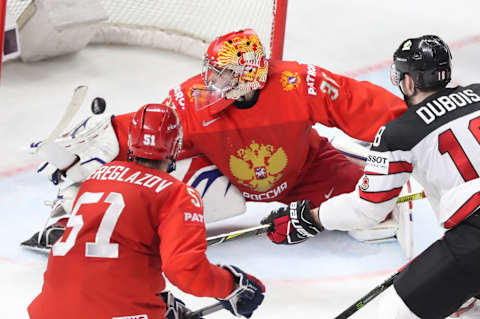 COPENHAGEN, DENMARK – MAY 17, 2018: Russia’s Alexei Bereglazov, goalie Igor Shestyorkin, and Jean-Gabriel Pageau (L-R) in action in their 2018 IIHF Ice Hockey World Championship Quarterfinal match at Royal Arena. Anton Novoderezhkin/TASS (Photo by Anton NovoderezhkinTASS via Getty Images)