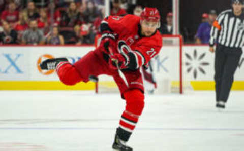 RALEIGH, NC – SEPTEMBER 29: Carolina Hurricanes right wing Nino Niederreiter (21) shoots the puck into the zone during an NHL Preseason game between the Washington Capitals and the Carolina Hurricanes on September 29, 2019 at the PNC Arena in Raleigh, NC. (Photo by Greg Thompson/Icon Sportswire via Getty Images)