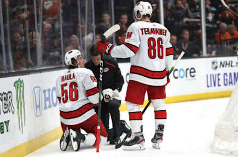 ANAHEIM, CALIFORNIA – OCTOBER 18: Teuvo Teravainen #86 looks on as Erik Haula #56 of the Carolina Hurricanes is slow to get up off the ice after a check by Josh Manson #42 of the Anaheim Ducks during the second period of a game at Honda Center on October 18, 2019 in Anaheim, California. (Photo by Sean M. Haffey/Getty Images)