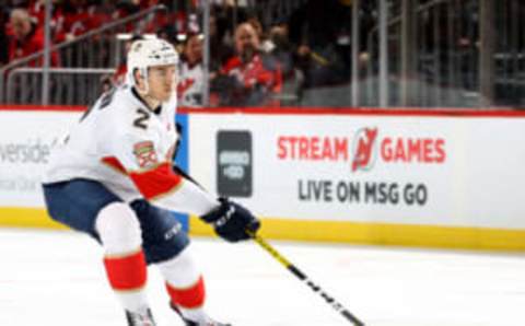 NEWARK, NEW JERSEY – FEBRUARY 11: Josh Brown #2 of the Florida Panthers passes the puck in the third period against the New Jersey Devils at Prudential Center on February 11, 2020 in Newark, New Jersey.The Florida Panthers defeated the New Jersey Devils 5-3. (Photo by Elsa/Getty Images)