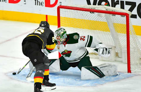 May 28, 2021; Las Vegas, Nevada, USA; Vegas Golden Knights center Mattias Janmark (26) scores a first period goal against Minnesota Wild goaltender Cam Talbot (33) in game seven of the first round of the 2021 Stanley Cup Playoffs at T-Mobile Arena. Mandatory Credit: Stephen R. Sylvanie-USA TODAY Sports