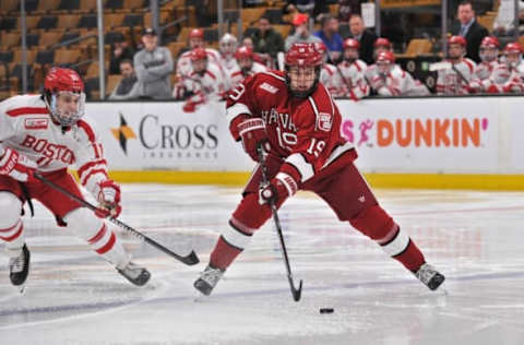 BOSTON, MA – FEBRUARY 11: Harvard Crimson forward Jack Drury (19) skates across the blue line with the puck. During the Harvard Crimson game against the Boston University Terriers on February 11, 2019 at TD Garden in Boston, MA.(Photo by Michael Tureski/Icon Sportswire via Getty Images)