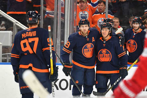 EDMONTON, AB – OCTOBER 18: Leon Draisaitl #29, Ethan Bear #74 and Connor McDavid #97 of the Edmonton Oilers celebrate after a goal during the game against the Detroit Red Wings on October 18, 2019, at Rogers Place in Edmonton, Alberta, Canada. (Photo by Andy Devlin/NHLI via Getty Images)