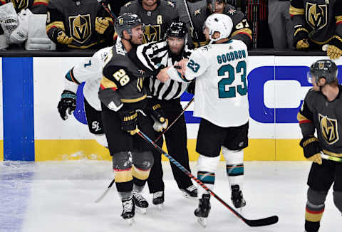 LAS VEGAS, NEVADA – OCTOBER 02: William Carrier #28 of the Vegas Golden Knights and Barclay Goodrow #23 of the San Jose Sharks are separated by the referee during the second period at T-Mobile Arena on October 02, 2019 in Las Vegas, Nevada. (Photo by Chris Unger/NHLI via Getty Images)